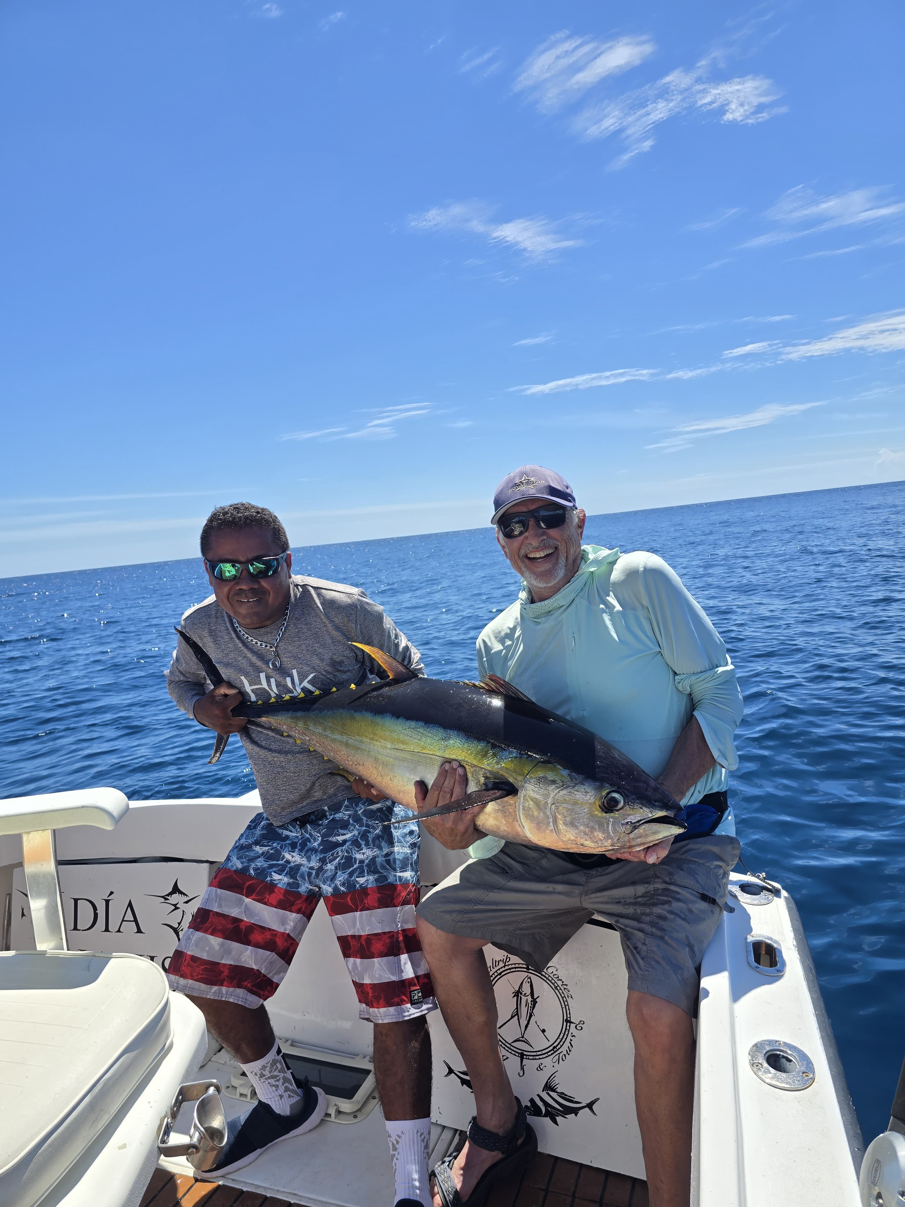 Happy anglers with mahi-mahi