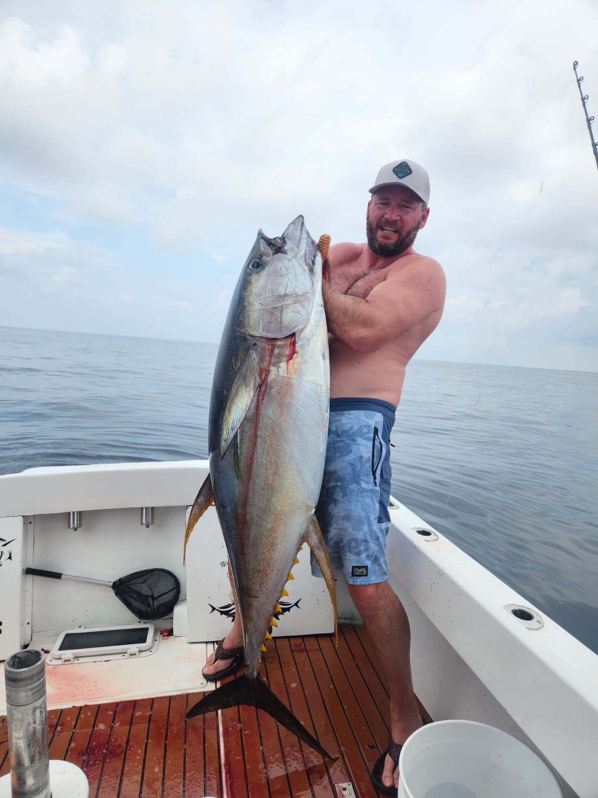 Angler with mahi-mahi on deck