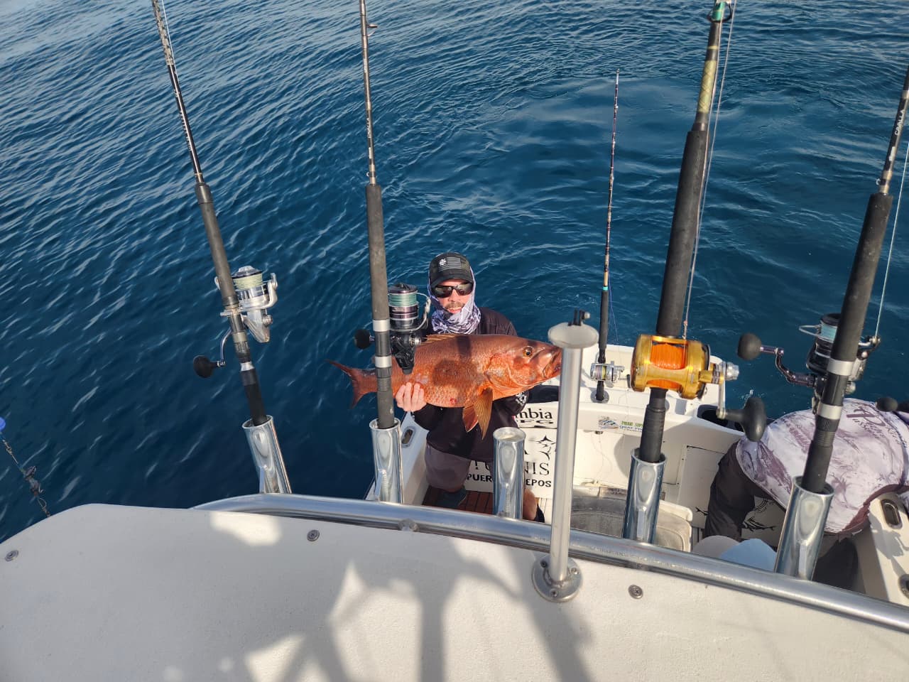 Angler with mullet snapper on deck
